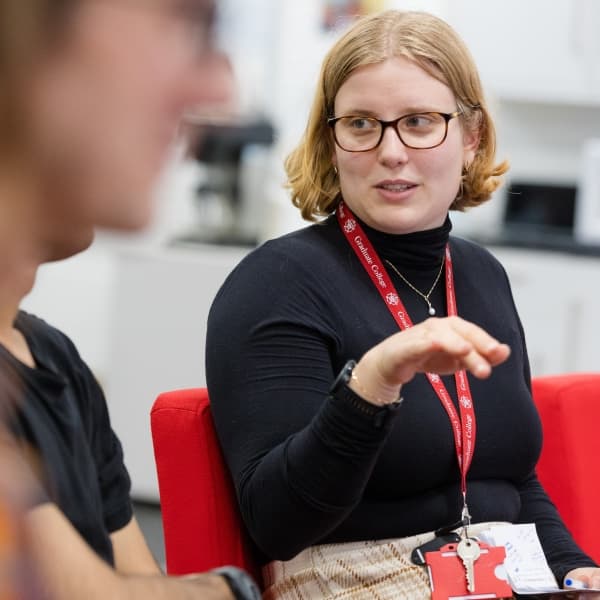 A student talking to another within the STOR-i communal area