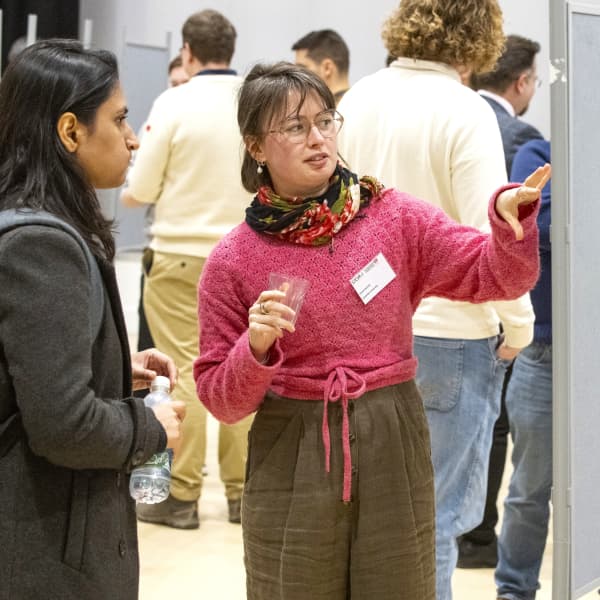 Student displaying their research poster at the STOR-i annual conference 