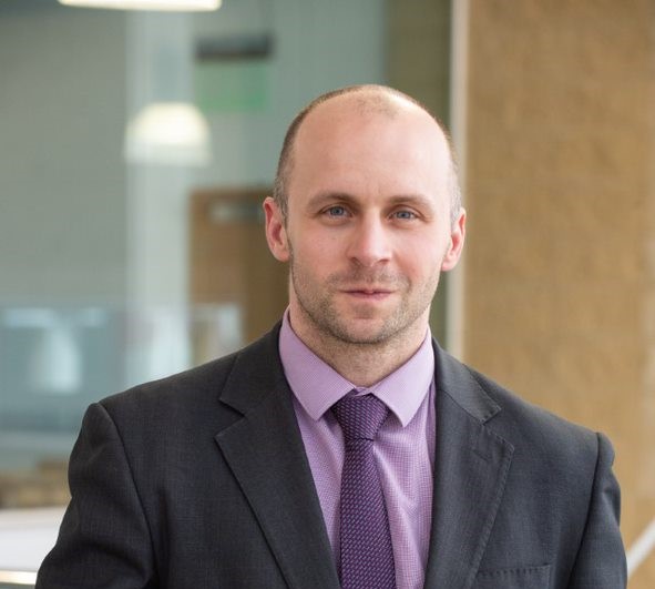 Headshot image of Adrian Jonas