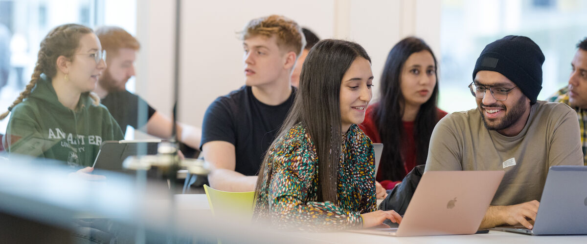 Students in a classroom in Charles Carter.