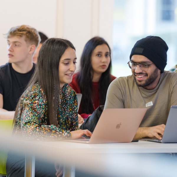 Group of people sitting together talking.
