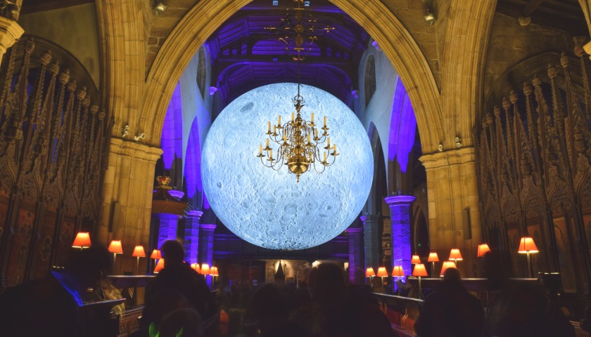 A large illuminated moon in the Priory.