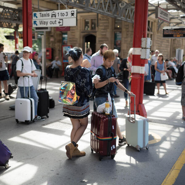 People waiting at Lancaster train station.