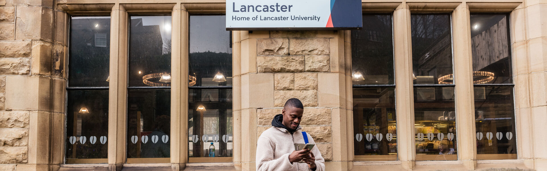Student stood at the train station