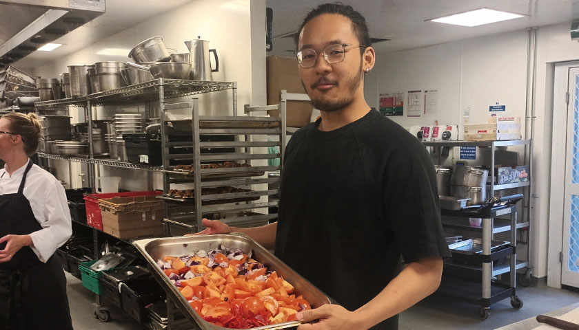 Student showing off food