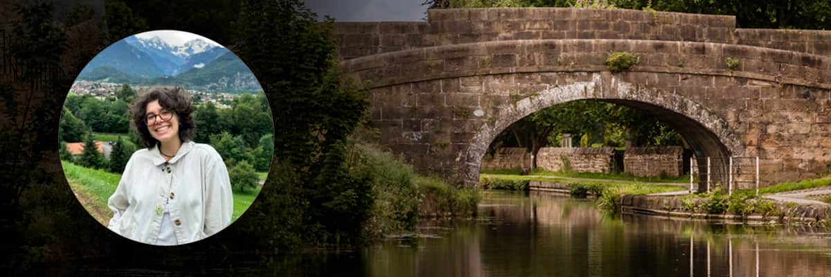 Student profile with scenic view of bridge over Lancaster canal