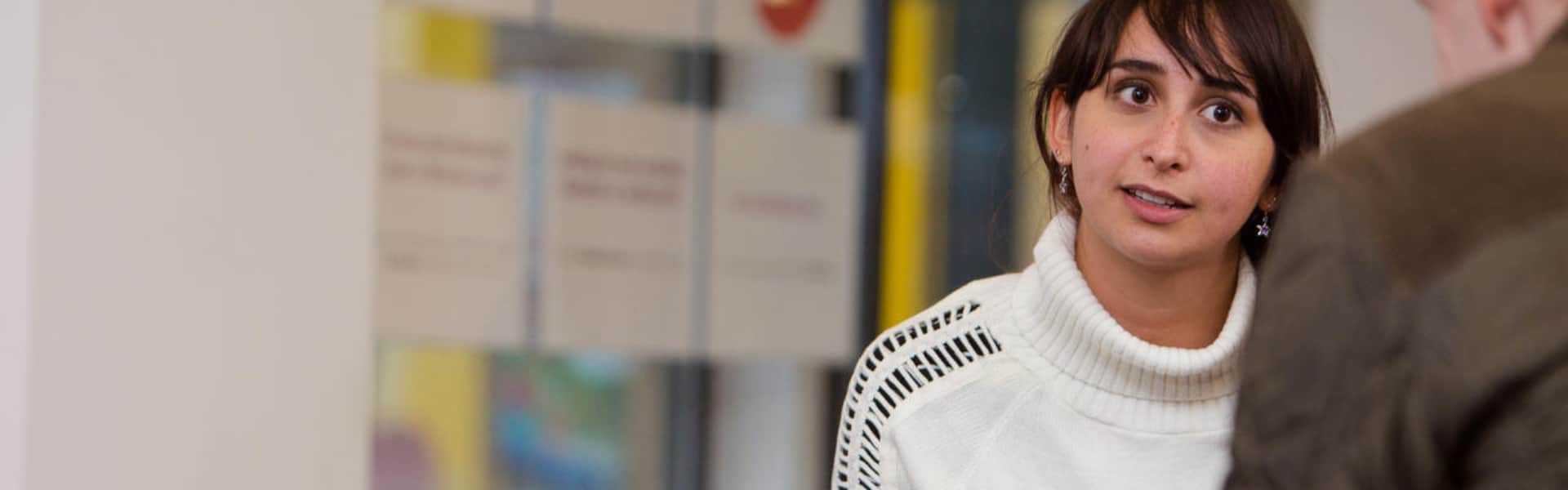 Staff member listening to student talking to them